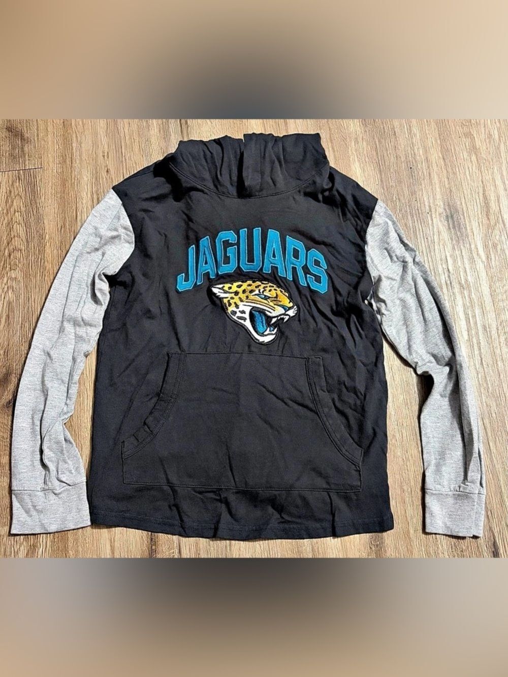 NFL Team Apparel-Jacksonville Jaguars- Long Sleeve Hooded Shirt - Youth Medium